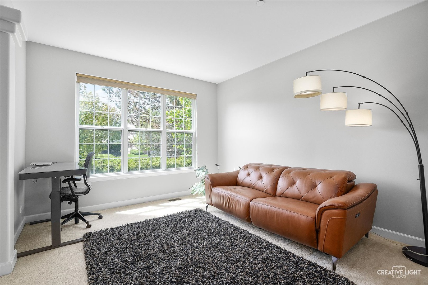 5912 Mackinac Lane Hoffman Estates, IL 60192 - Photo 5 of 32 a living room with furniture and a window