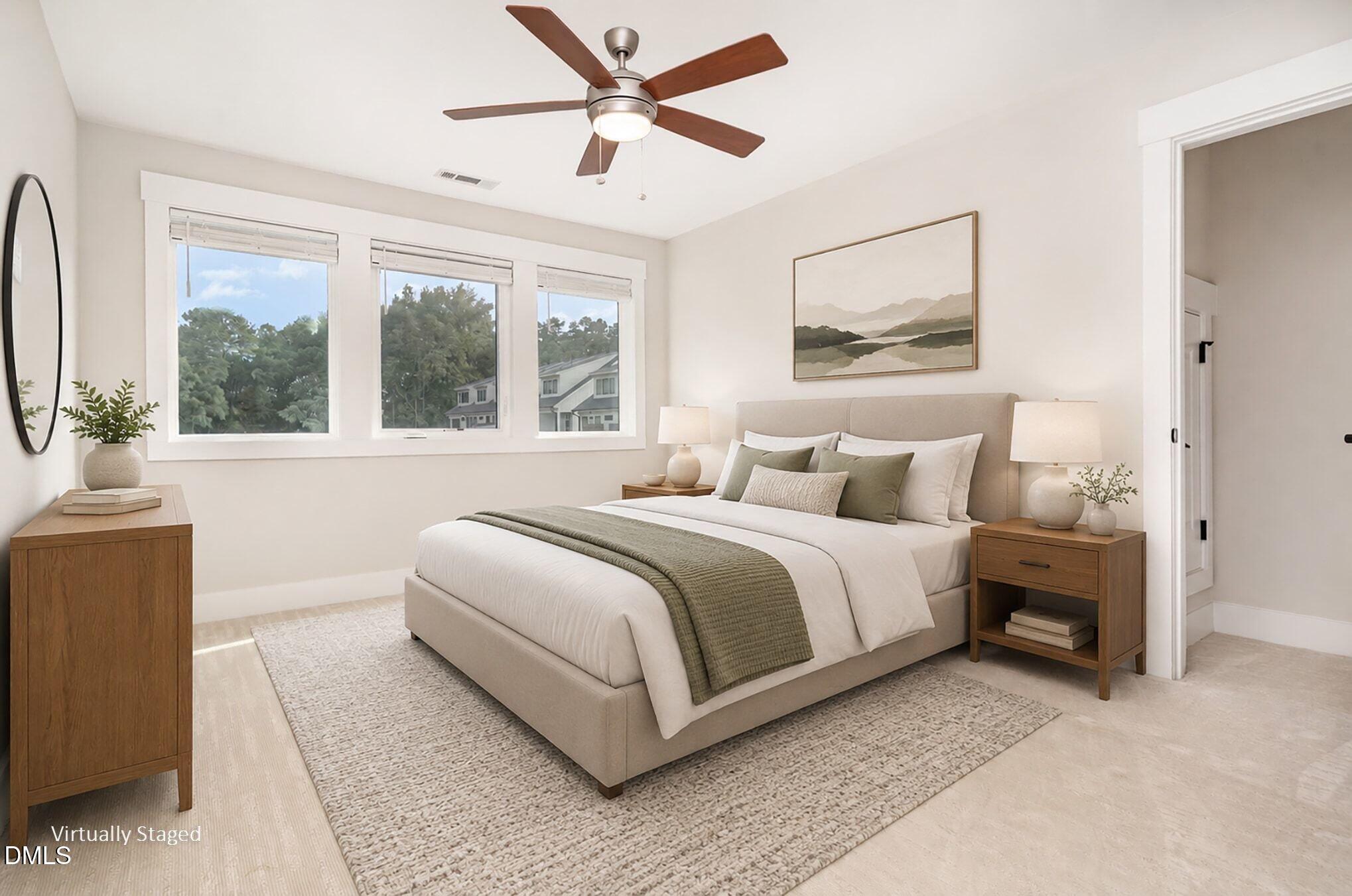 4016 Emerald Green Road Raleigh, NC 27612 - Photo 14 of 22 a bedroom with a large bed and a window