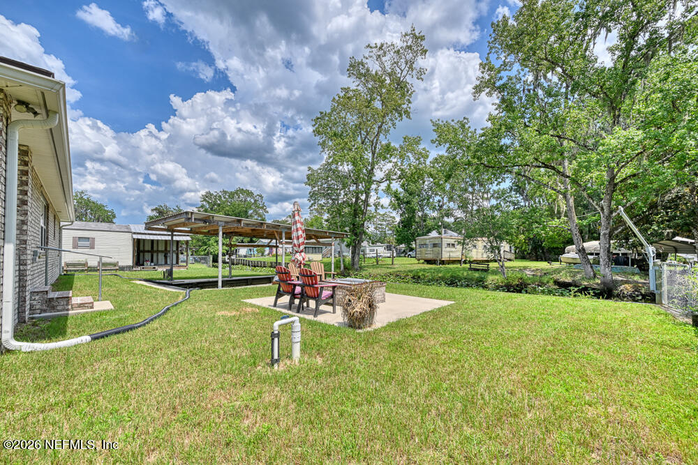 7837 Rusty Anchor Road St. Augustine, FL 32092 - Photo 23 of 41 Back Yard area showing firepit
