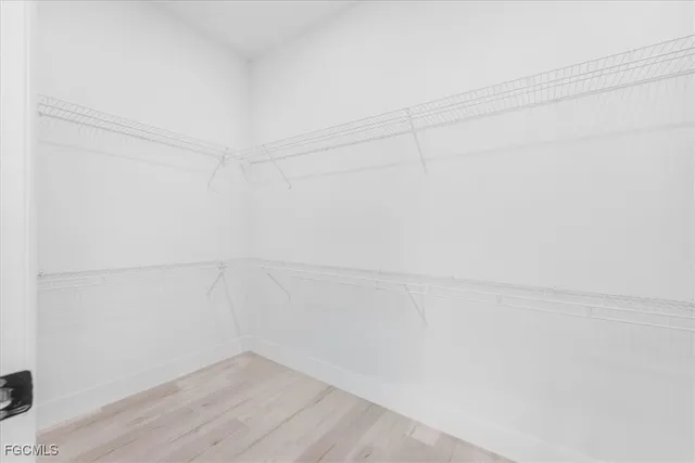 a bathroom with a sink a mirror and a shower