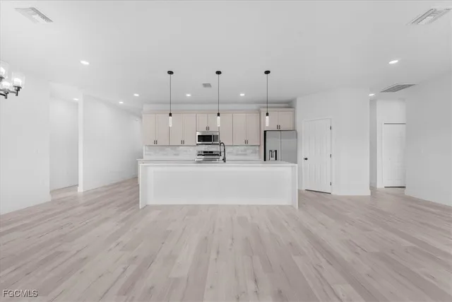 a view of kitchen with wooden floor