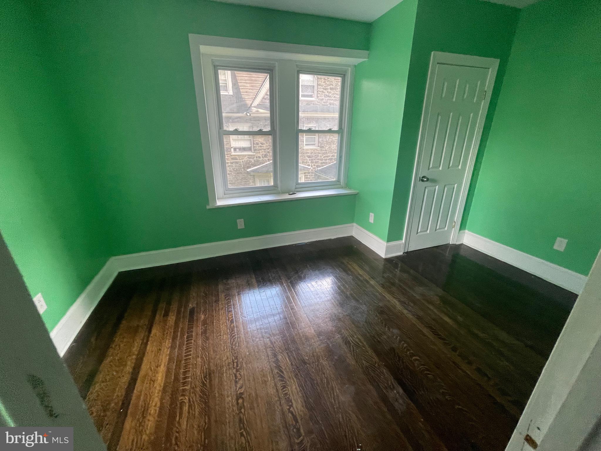 6416 Overbrook Avenue Philadelphia, PA 19151 - Photo 18 of 18 a view of a room with wooden floor and a window