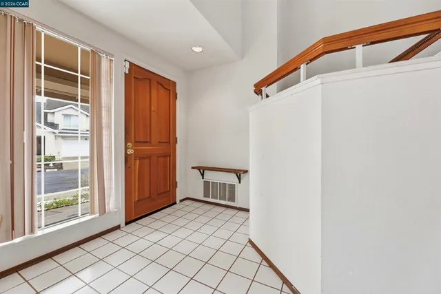 a view of empty room with windows