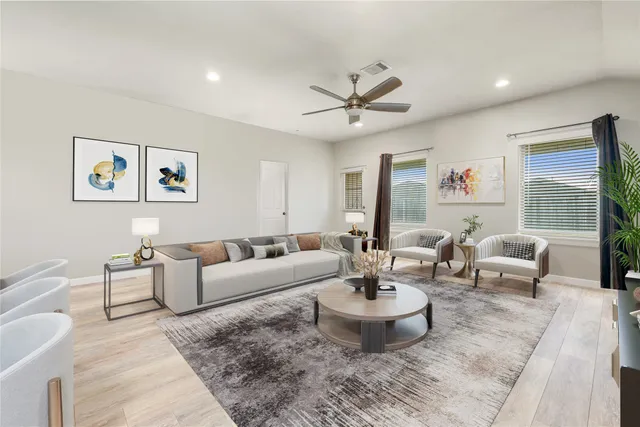 a living room with furniture and a large window