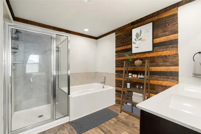 a bathroom with a bathtub and a shower