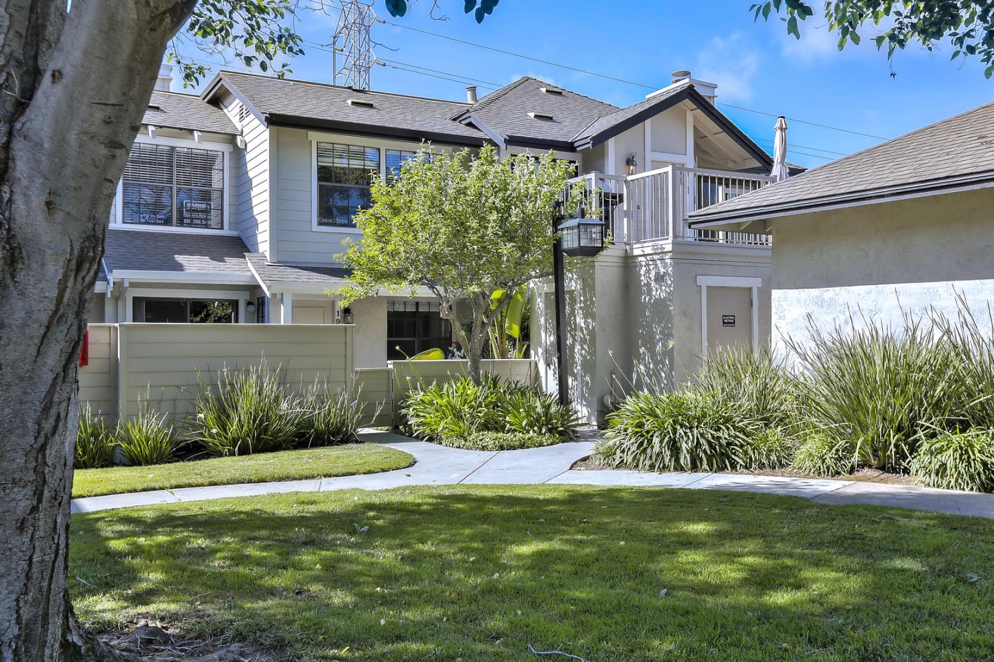 1925 Vista Cay San Mateo, CA 94404 - Photo 1 of 24 a front view of a house with garden