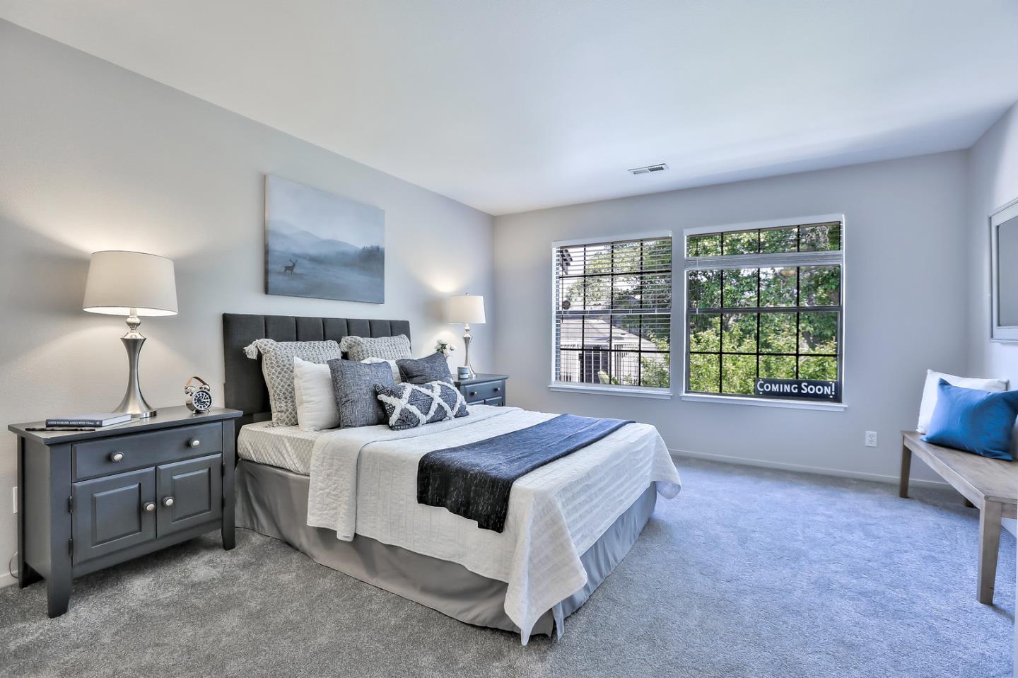 1925 Vista Cay San Mateo, CA 94404 - Photo 14 of 24 a bedroom with a bed and a large window