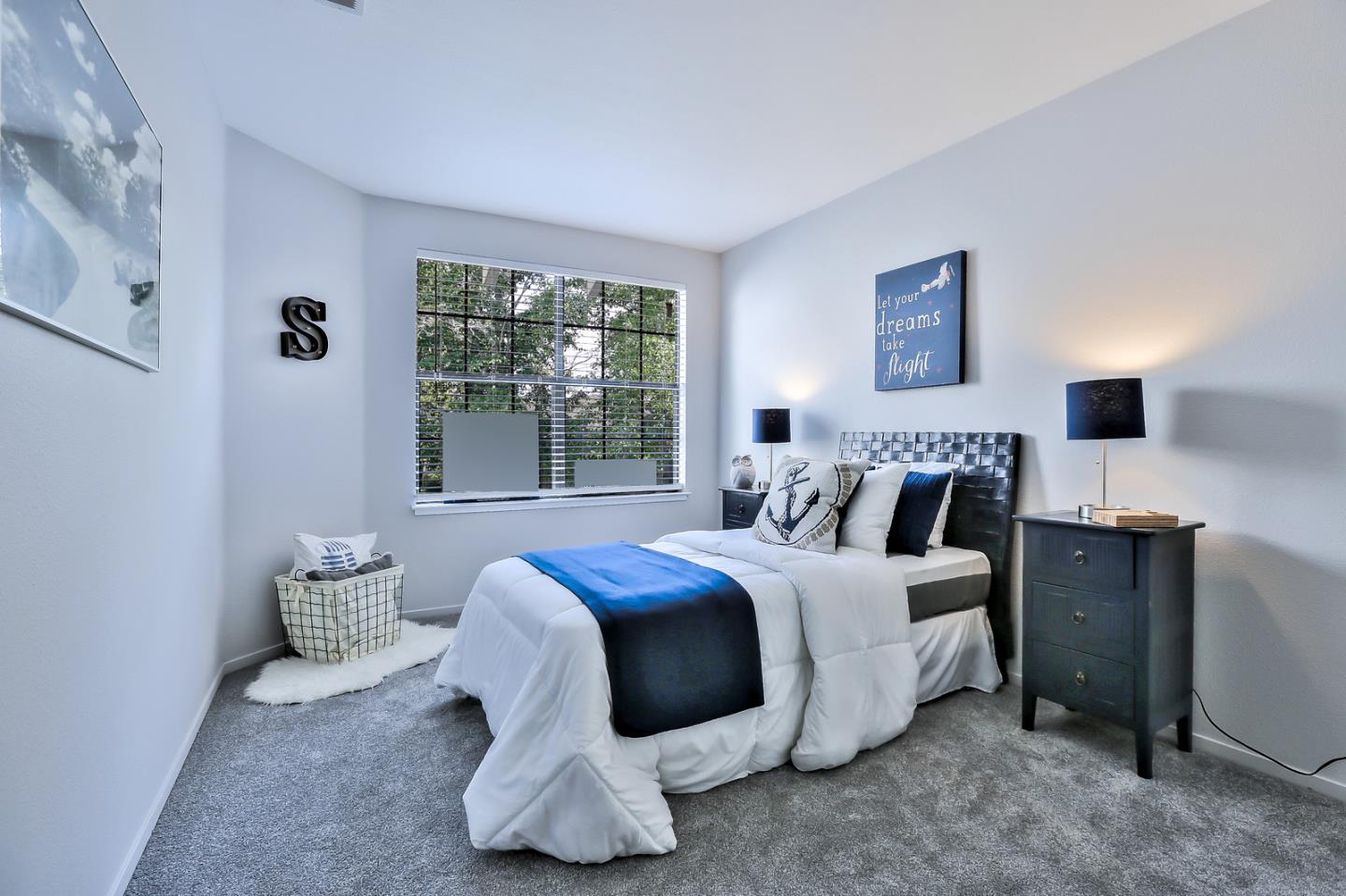 1925 Vista Cay San Mateo, CA 94404 - Photo 18 of 24 a bedroom with a bed and a night stand