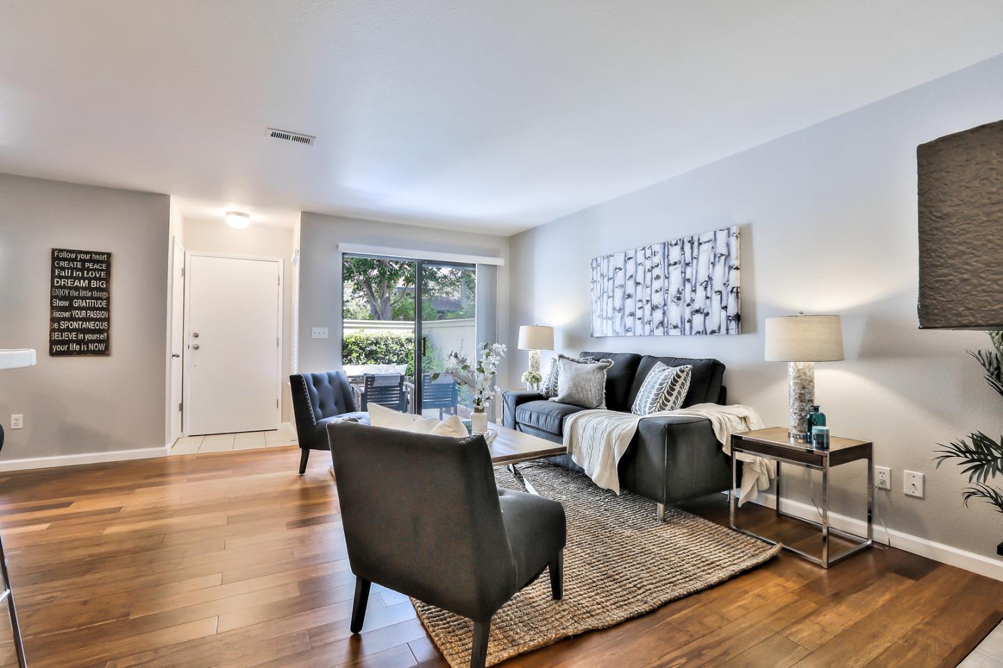 1925 Vista Cay San Mateo, CA 94404 - Photo 8 of 24 a living room with furniture floor to ceiling window and wooden floor