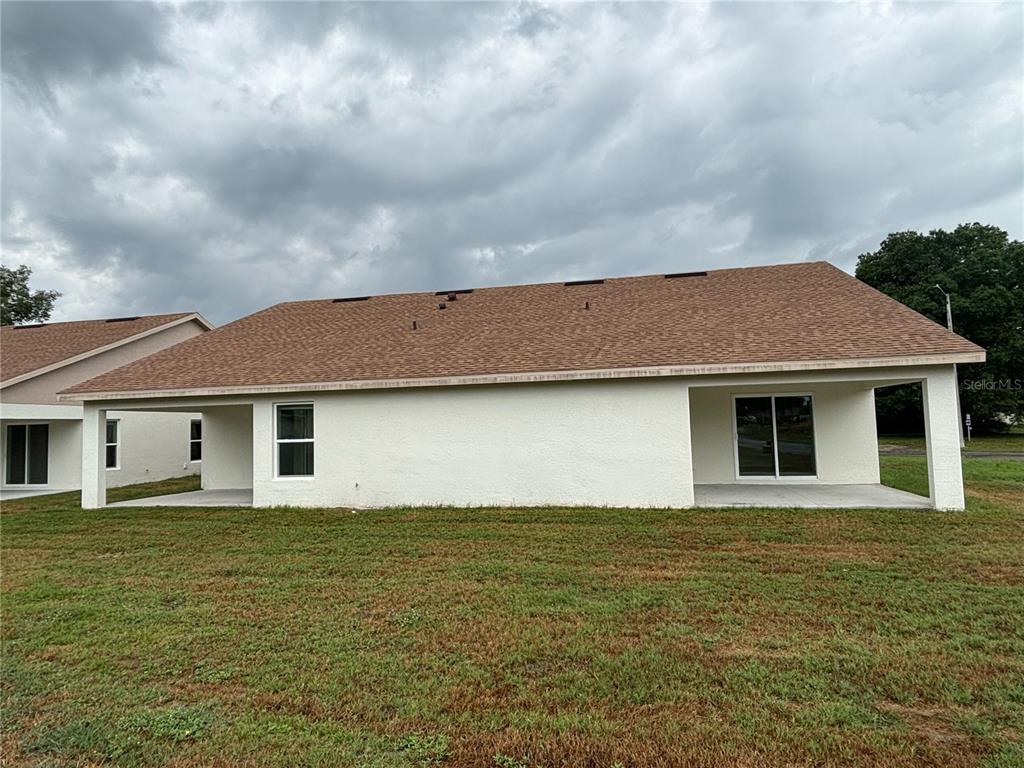 4078 Oak Loop Mulberry, FL 33860 - Photo 18 of 19 a front view of house with yard