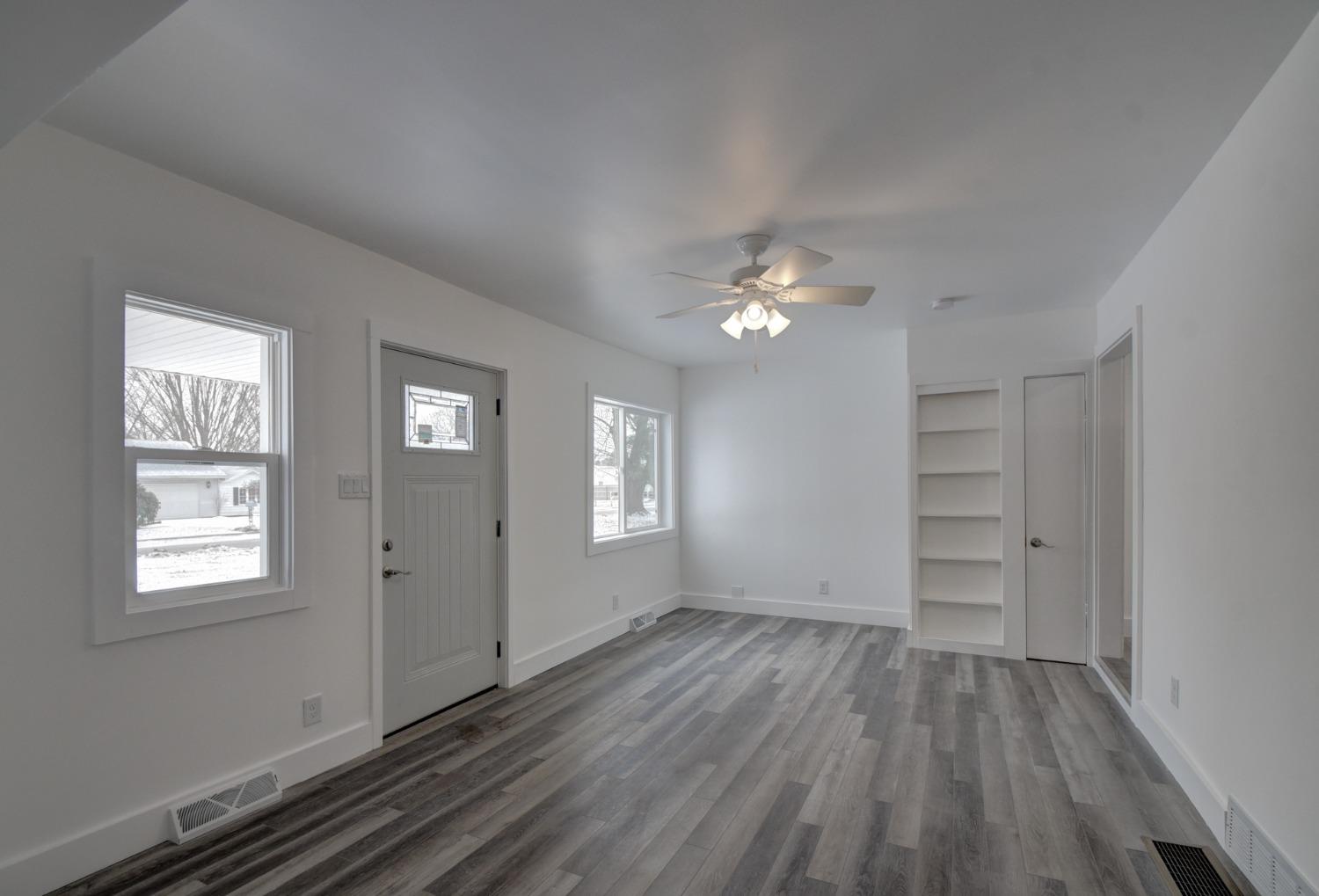 1604 Webber Street La Porte, IN 46350 - Photo 11 of 22 wooden floor in an empty room with a window