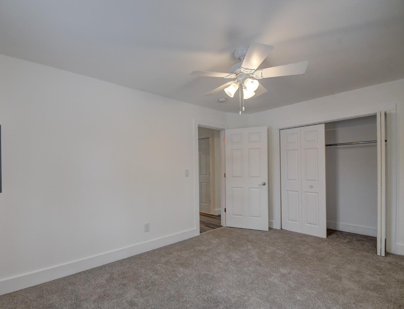 1604 Webber Street La Porte, IN 46350 - Photo 22 of 22 an empty room with a ceiling fan and closet area