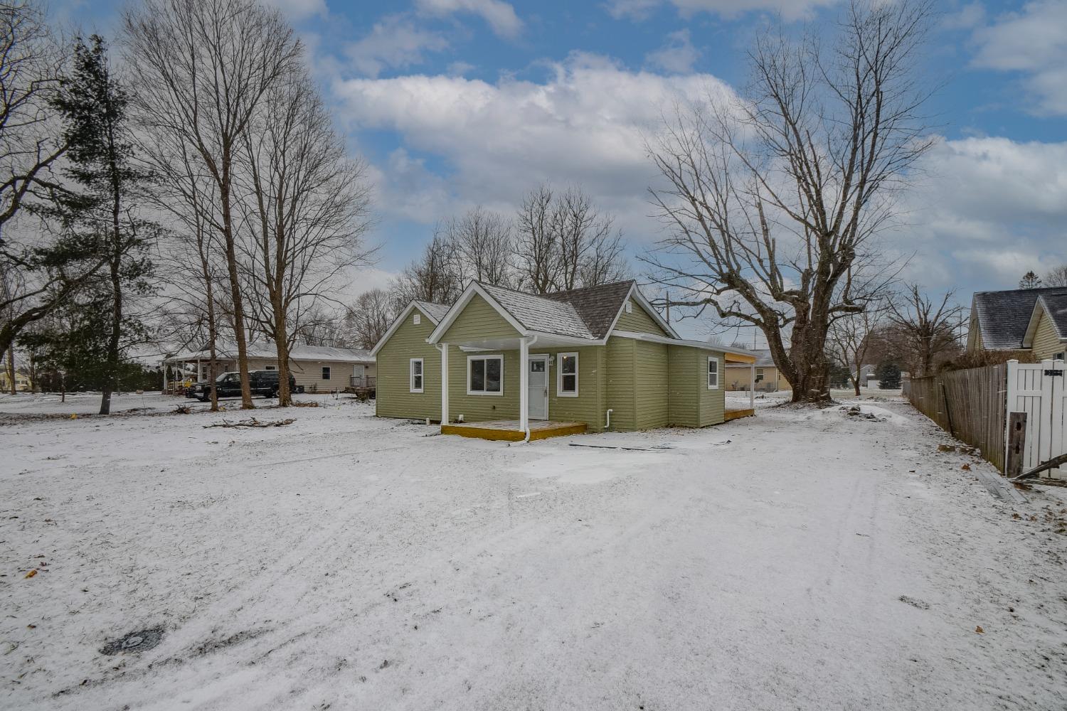 1604 Webber Street La Porte, IN 46350 - Photo 4 of 22 a view of a house with a yard covered in snow