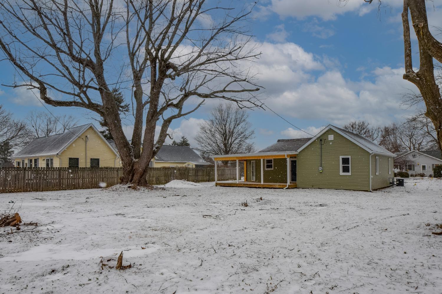 1604 Webber Street La Porte, IN 46350 - Photo 8 of 22 a front view of a house with a yard covered in snow