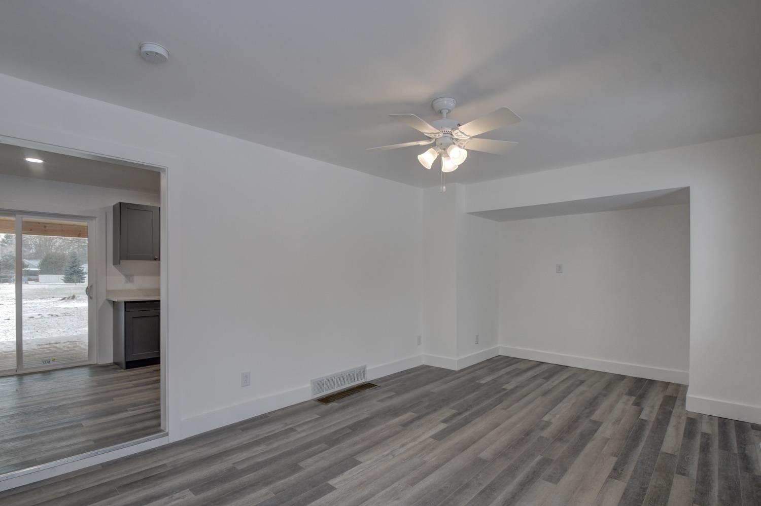 1604 Webber Street La Porte, IN 46350 - Photo 10 of 22 wooden floor in an empty room with a window