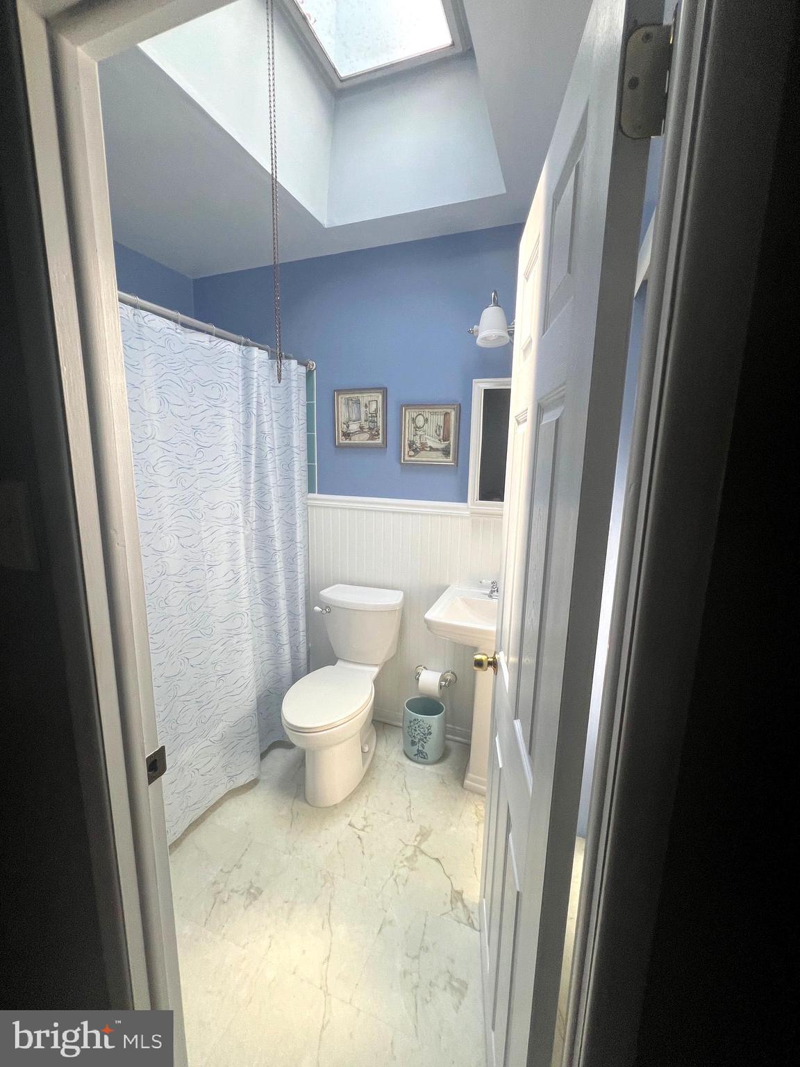 11854 Sewell Road Philadelphia, PA 19116 - Photo 8 of 22 Hall Bathroom Main Floor with Skylight