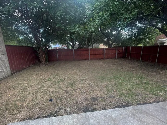 a view of backyard with green space