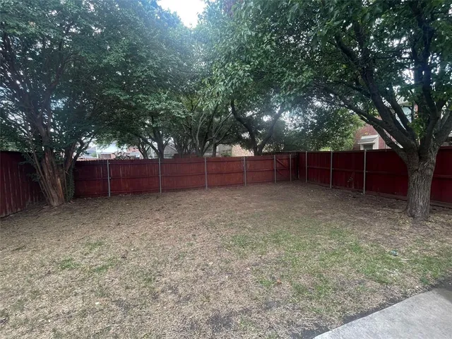 front view of a house with a tree