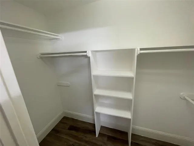 a view of an empty walk in closet