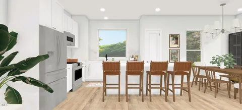 a view of kitchen with breakfast area