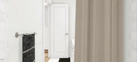 a bathroom with a shower and a mirror