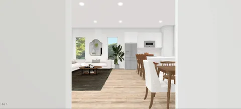 a view of a dining room with furniture window and outside view