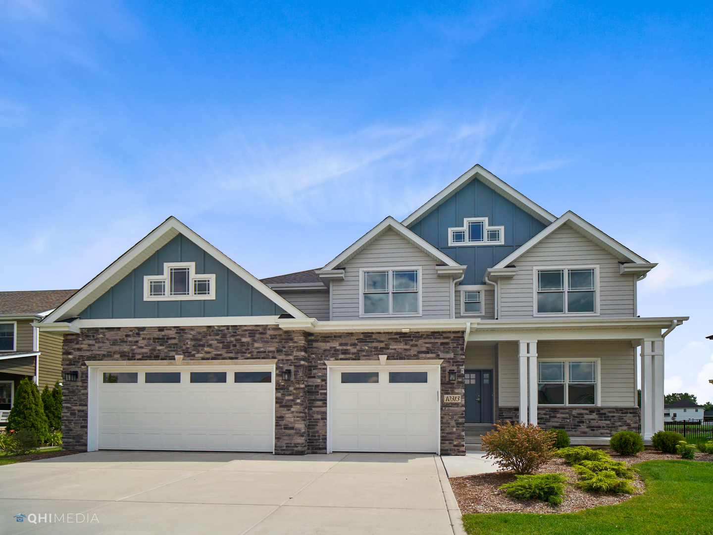 8233 Castle Drive Munster, IN 46321 - Photo 1 of 19 a front view of a house with a yard and garage