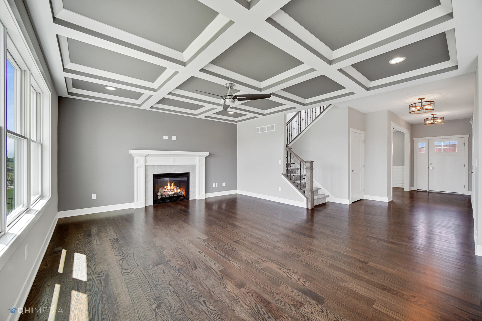 8233 Castle Drive Munster, IN 46321 - Photo 2 of 19 wooden floor in an empty room with a fireplace