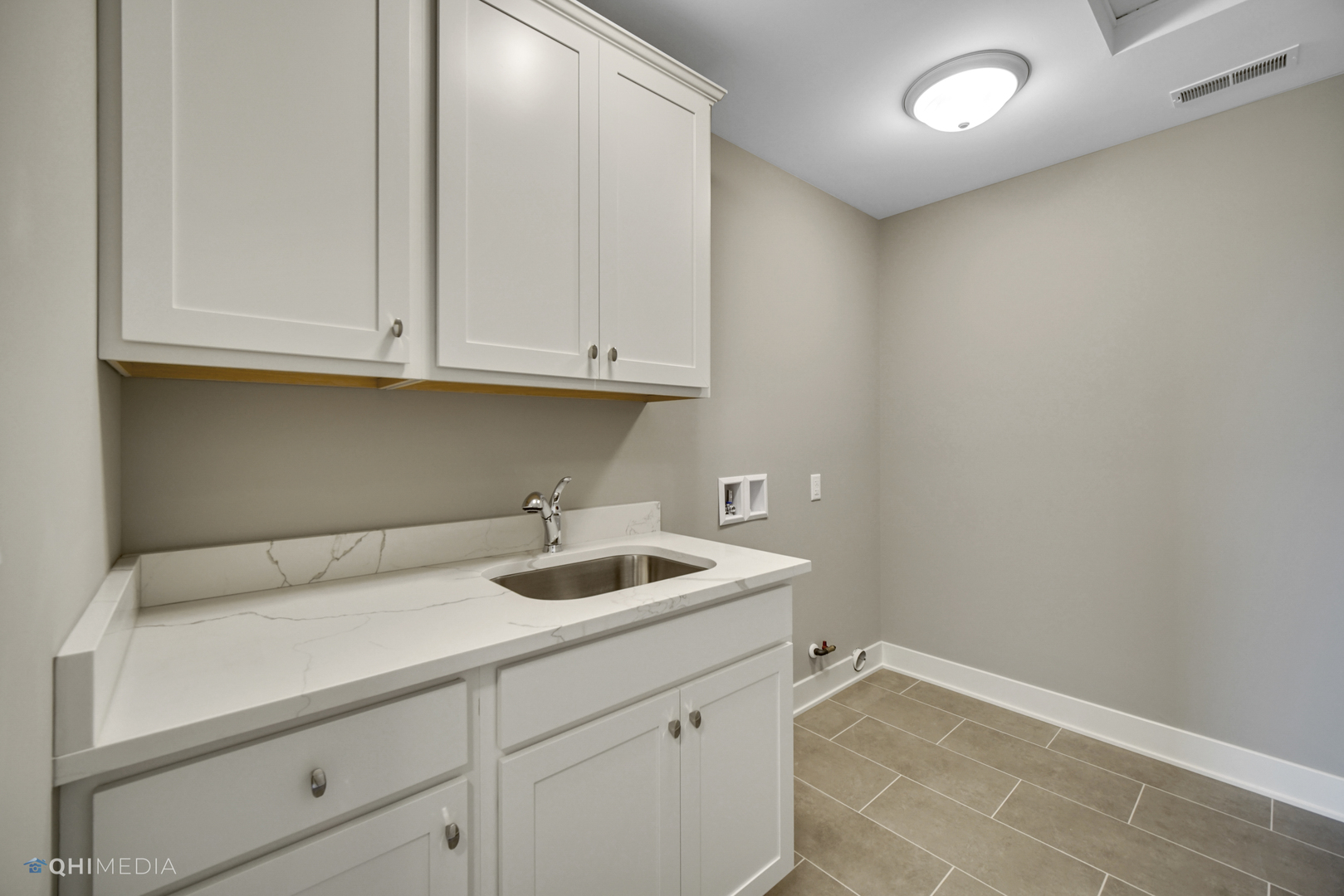 8233 Castle Drive Munster, IN 46321 - Photo 15 of 19 a kitchen with a sink and cabinets