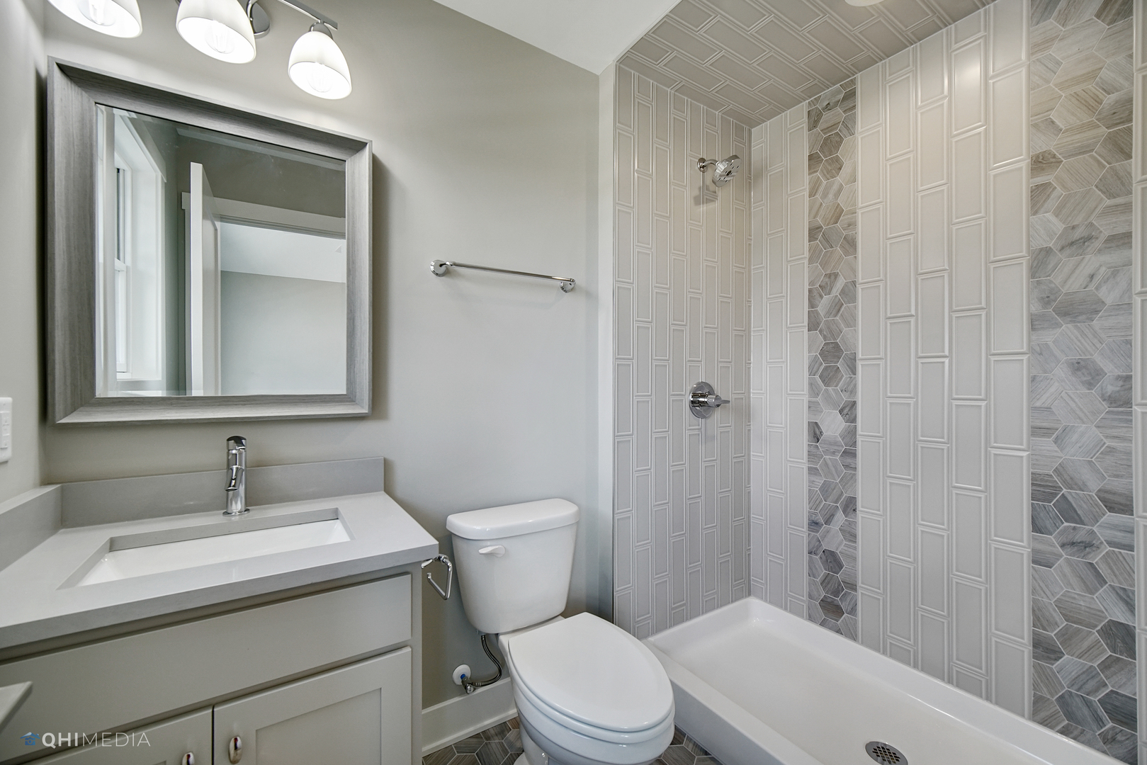 8233 Castle Drive Munster, IN 46321 - Photo 9 of 19 a bathroom with a sink a toilet and shower