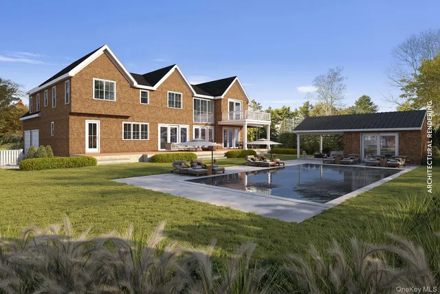 a view of a house with swimming pool and sitting area