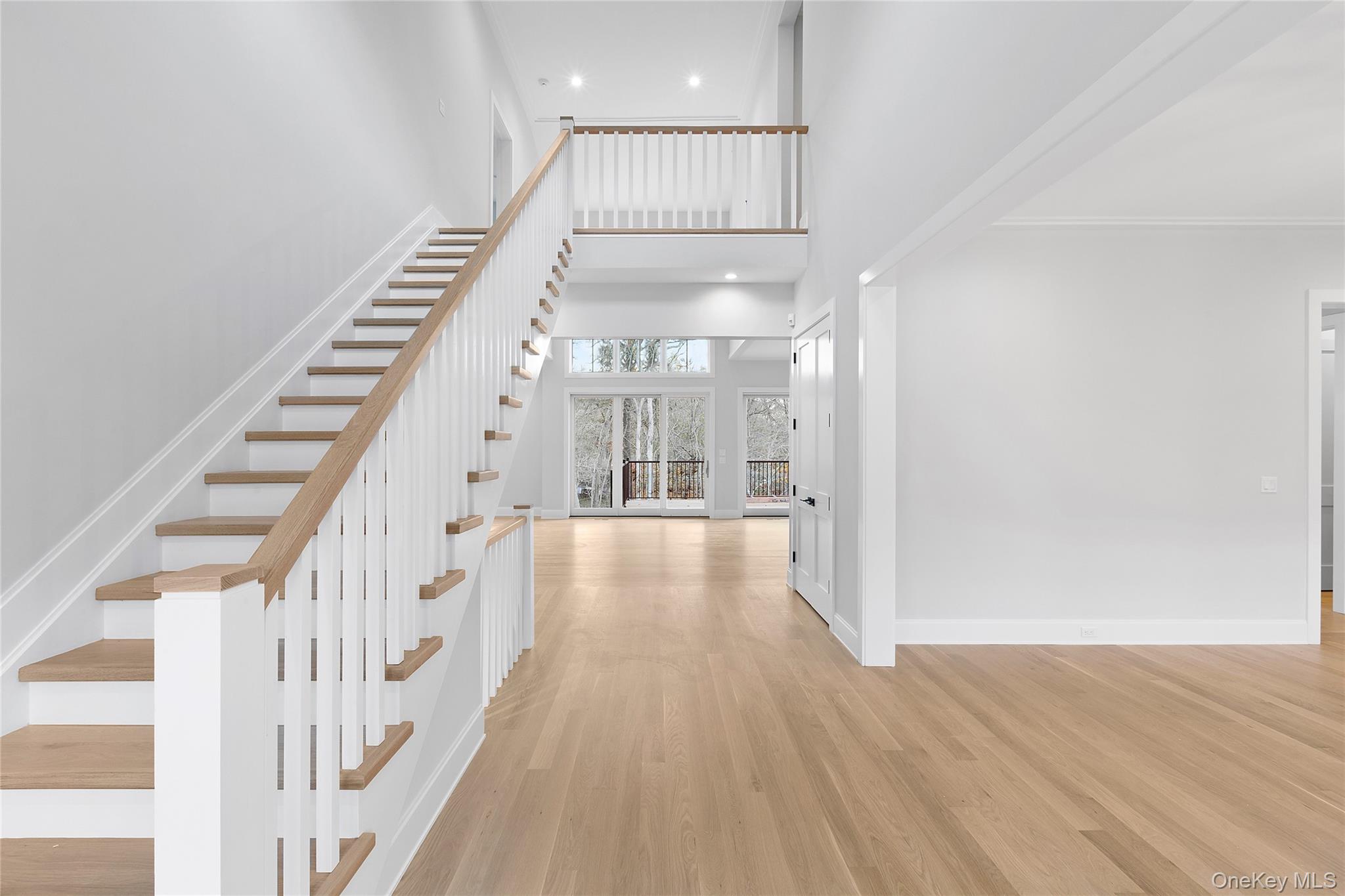 34 Old Main Road Quogue, NY 11959 - Photo 4 of 16 a view of entryway with wooden floor