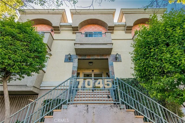 a view of balcony with wooden floor and a potted plant