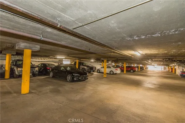 a view of parking garage with cars