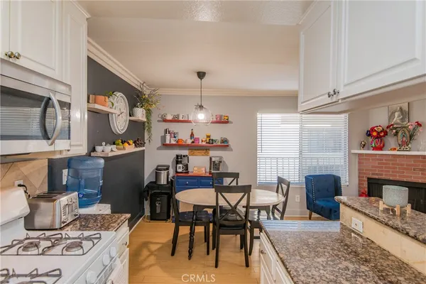 a dining room with furniture and a fireplace