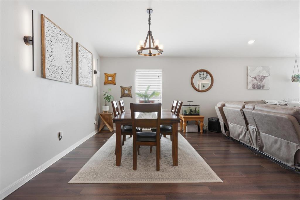 656 Carya Court DeLand, FL 32724 - Photo 12 of 28 a view of a dining room with furniture and window