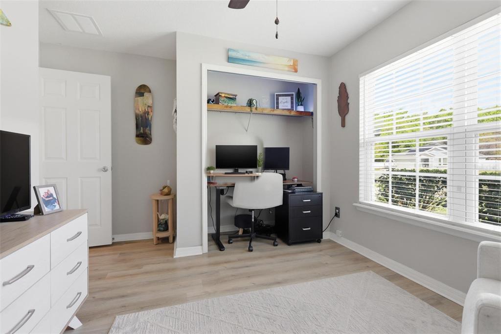 656 Carya Court DeLand, FL 32724 - Photo 16 of 28 a living room with furniture and a flat screen tv