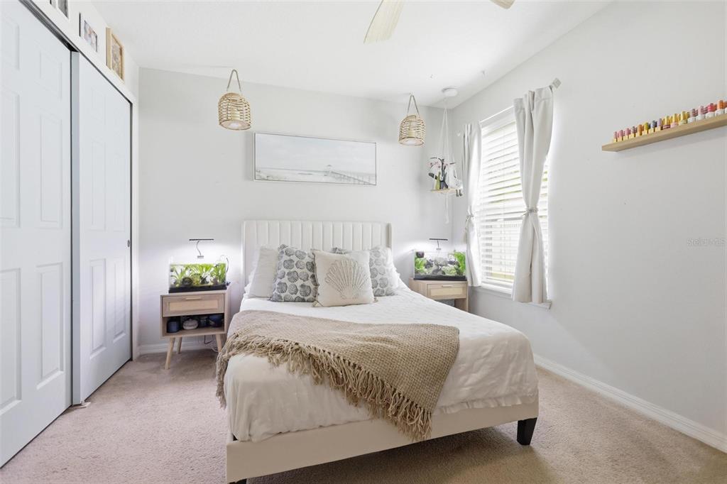 656 Carya Court DeLand, FL 32724 - Photo 19 of 28 a bedroom with a bed and a window