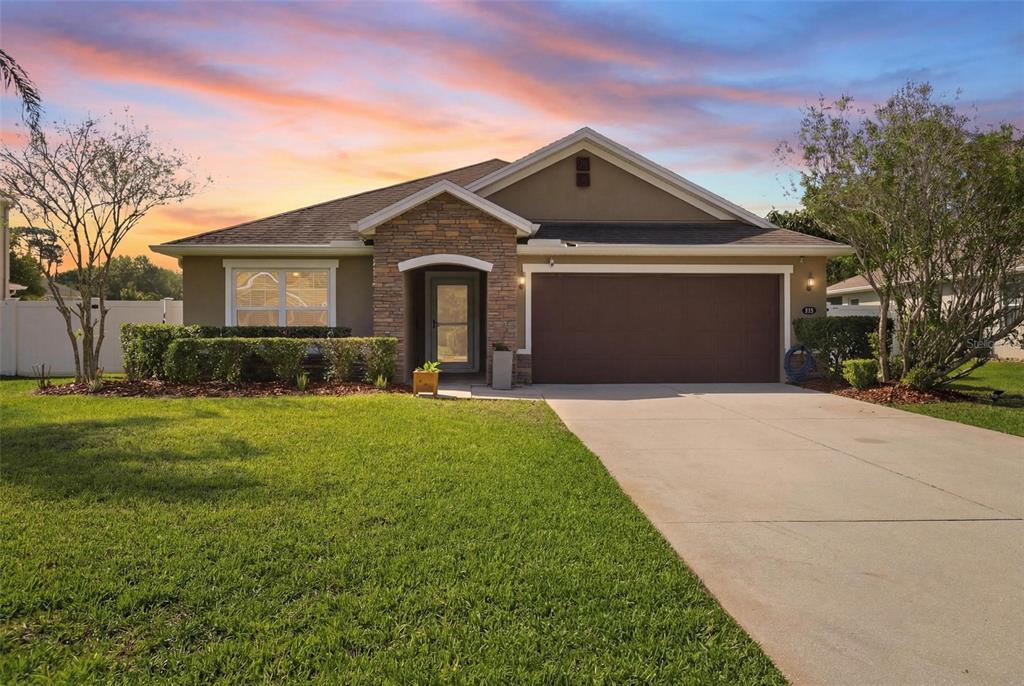 656 Carya Court DeLand, FL 32724 - Photo 2 of 28 a front view of a house with a yard