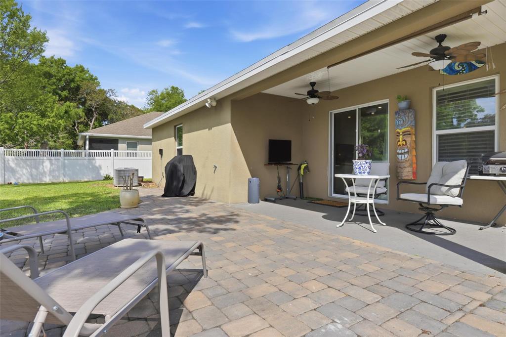 656 Carya Court DeLand, FL 32724 - Photo 24 of 28 a view of a house with backyard and a patio