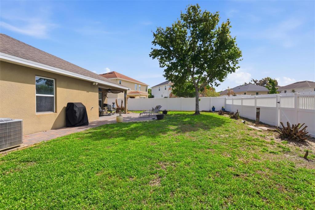 656 Carya Court DeLand, FL 32724 - Photo 26 of 28 a view of a house with backyard and a tree