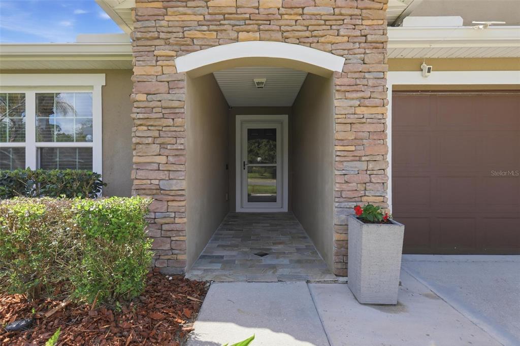 656 Carya Court DeLand, FL 32724 - Photo 3 of 28 a front view of a house with a plants