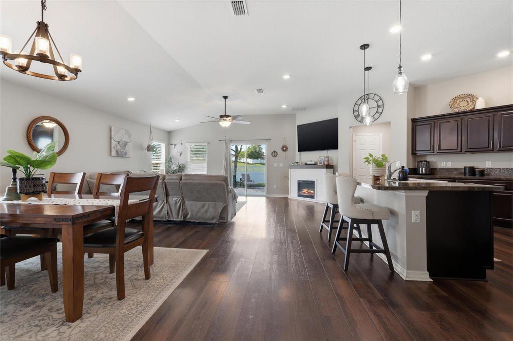 656 Carya Court DeLand, FL 32724 - Photo 5 of 28 a living room with fireplace furniture and a flat screen tv