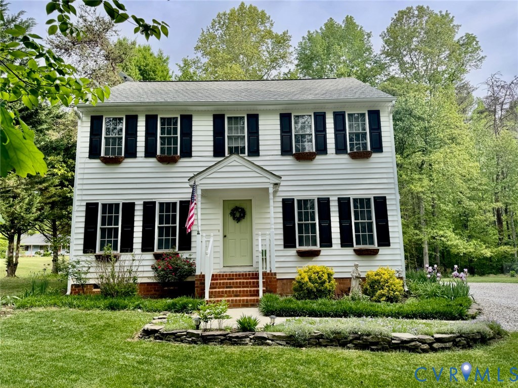 front view of a house with a yard
