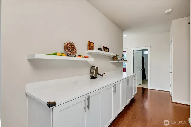 a bed room with a bed and a chair