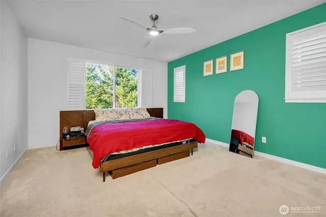 a bedroom with a bed and a window