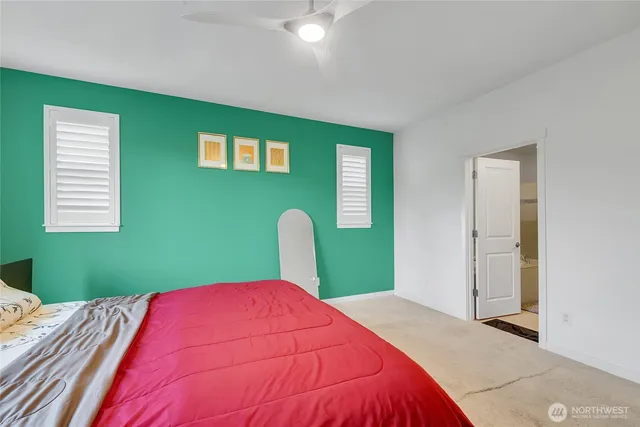 a bathroom with a sink double vanity granite tub shower and a mirror