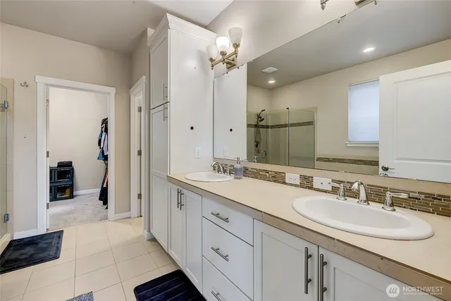 a bathroom with a sink and a shower