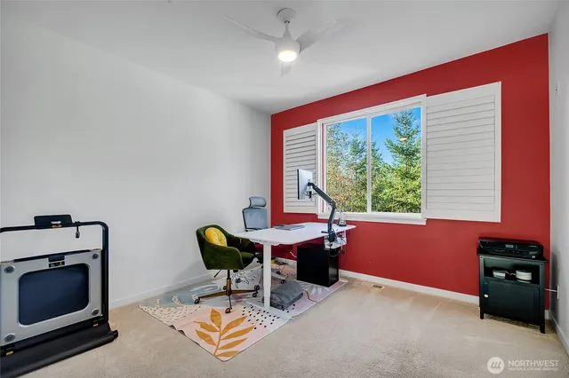a bathroom with a granite countertop sink a toilet a mirror a bathtub and shower