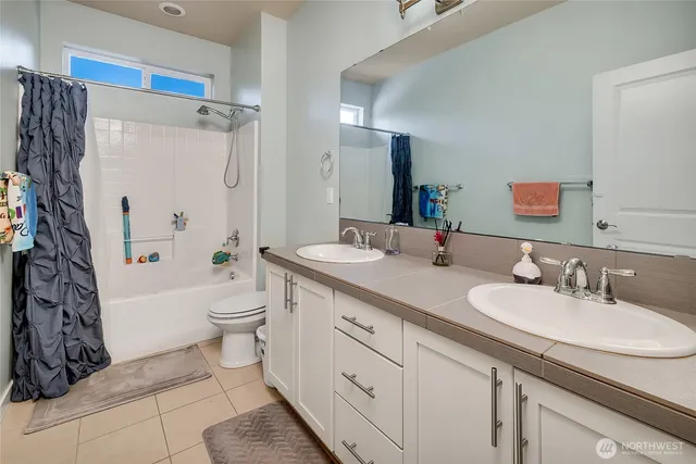 a stove top oven sitting inside of a kitchen